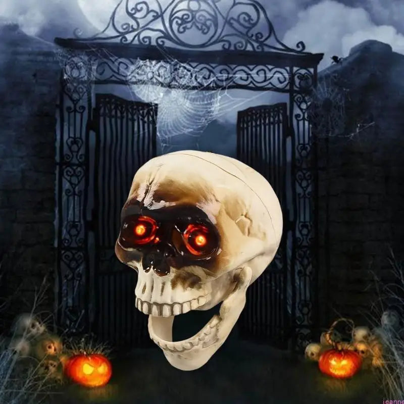 Animated Halloween skeleton head with glowing red eyes