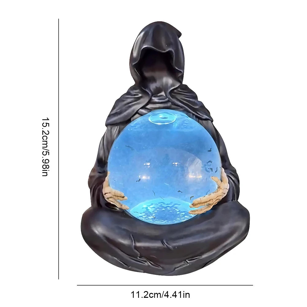 Close view of the reaper cloak and skeletal hands around the lit orb