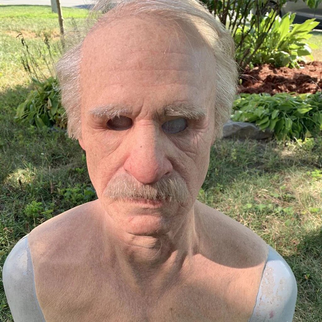 Old man latex mask shown from the side with wrinkled skin detail