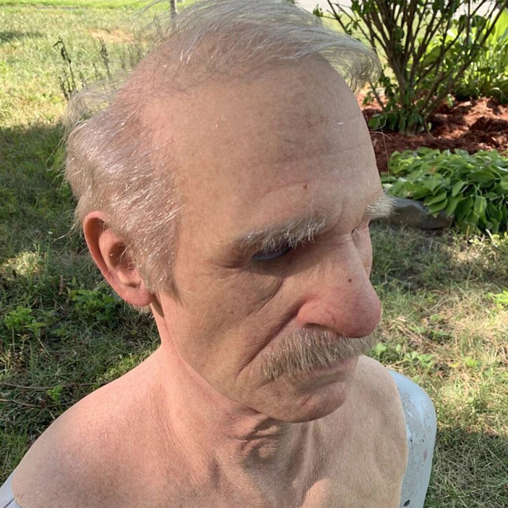Close view of the wrinkled latex detail on the old man mask