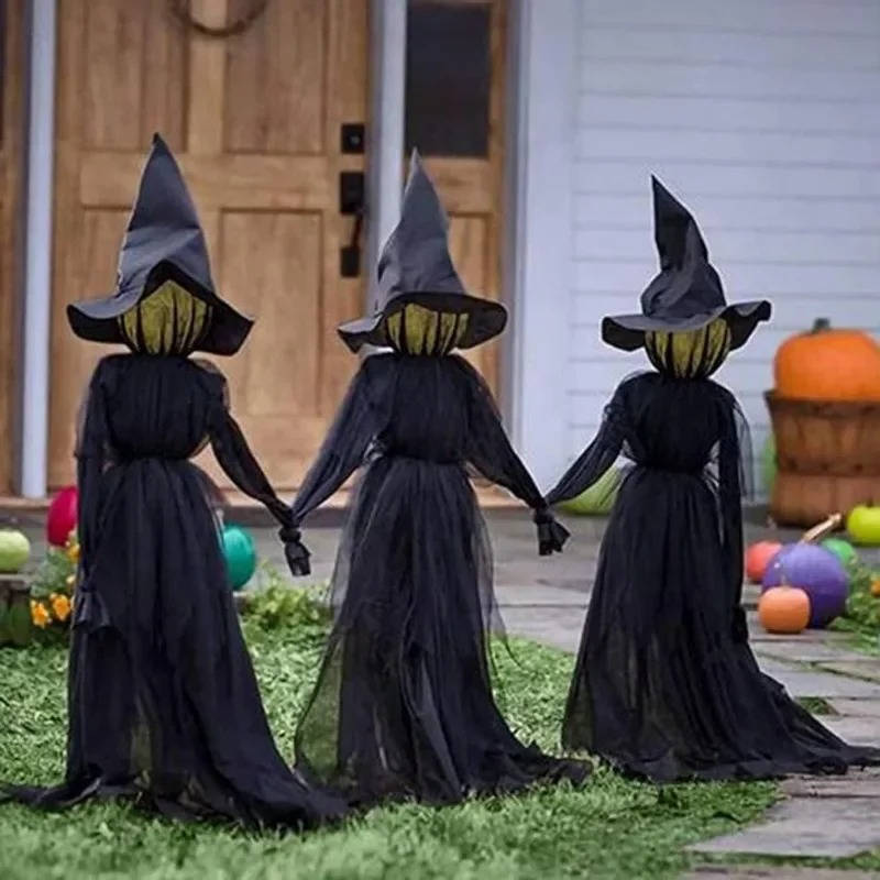 Close up of a glowing witch head on the Halloween decor set