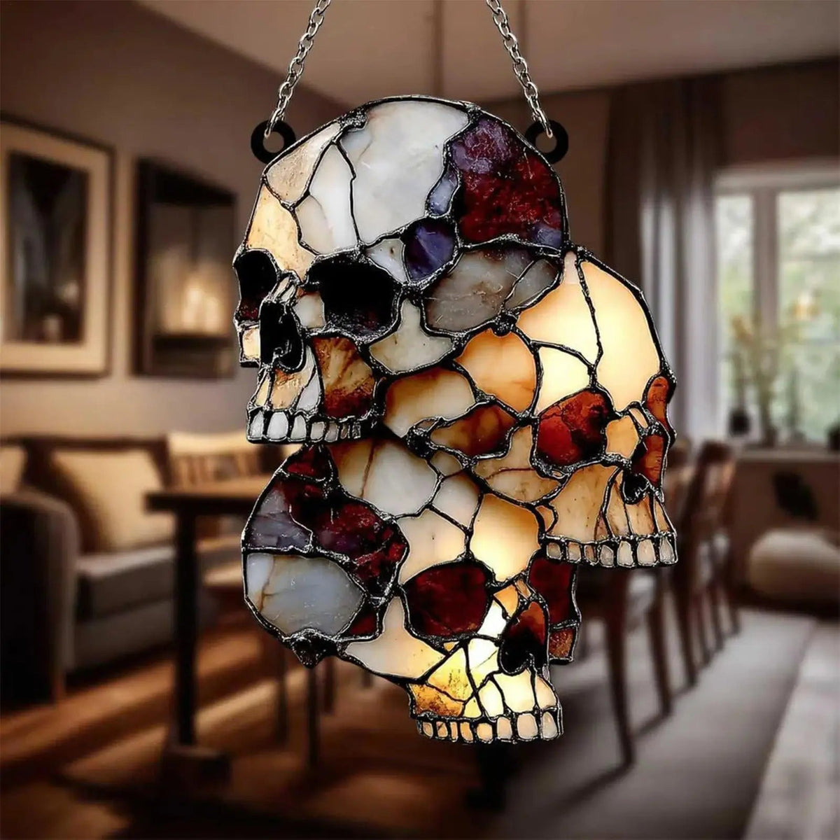 Hanging skeleton head ornament glowing after dark